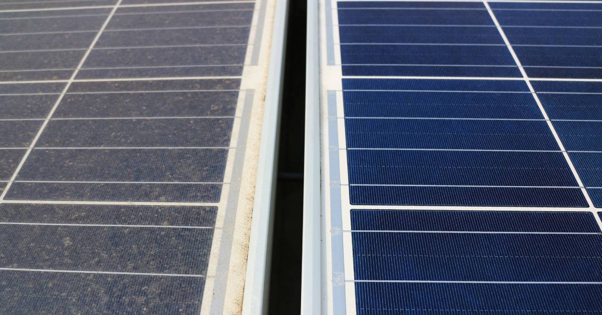 A close-up side-by-side view of one clean set of solar panels on the right next to a set of dirty, dust-covered panels.