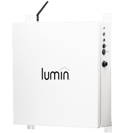 A white rectangular electronic device labeled "lumin" with an antenna on top, indicator lights, ports, and buttons on the side is mounted against a plain light background, featuring Greenlink compatibility for seamless connectivity.